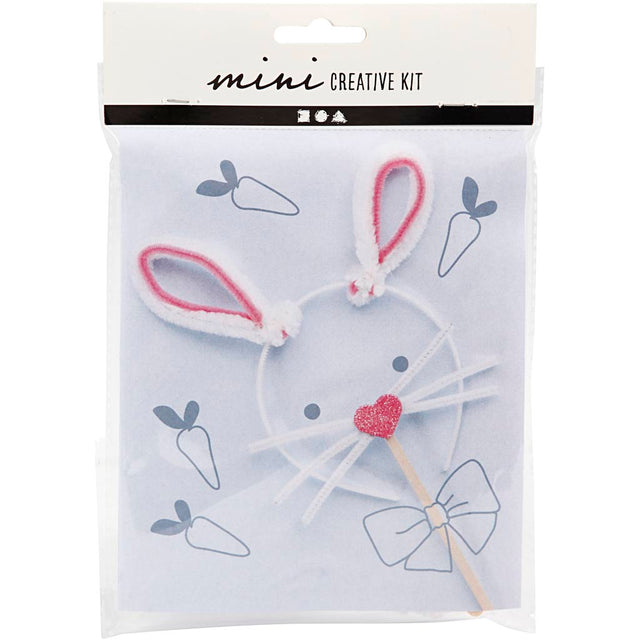 Mini creative kit with bunny ears and bow on a white background