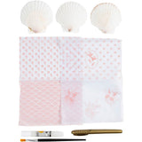 Decorative decoupage kit with floral patterns, three seashells, and a paintbrush on a white background