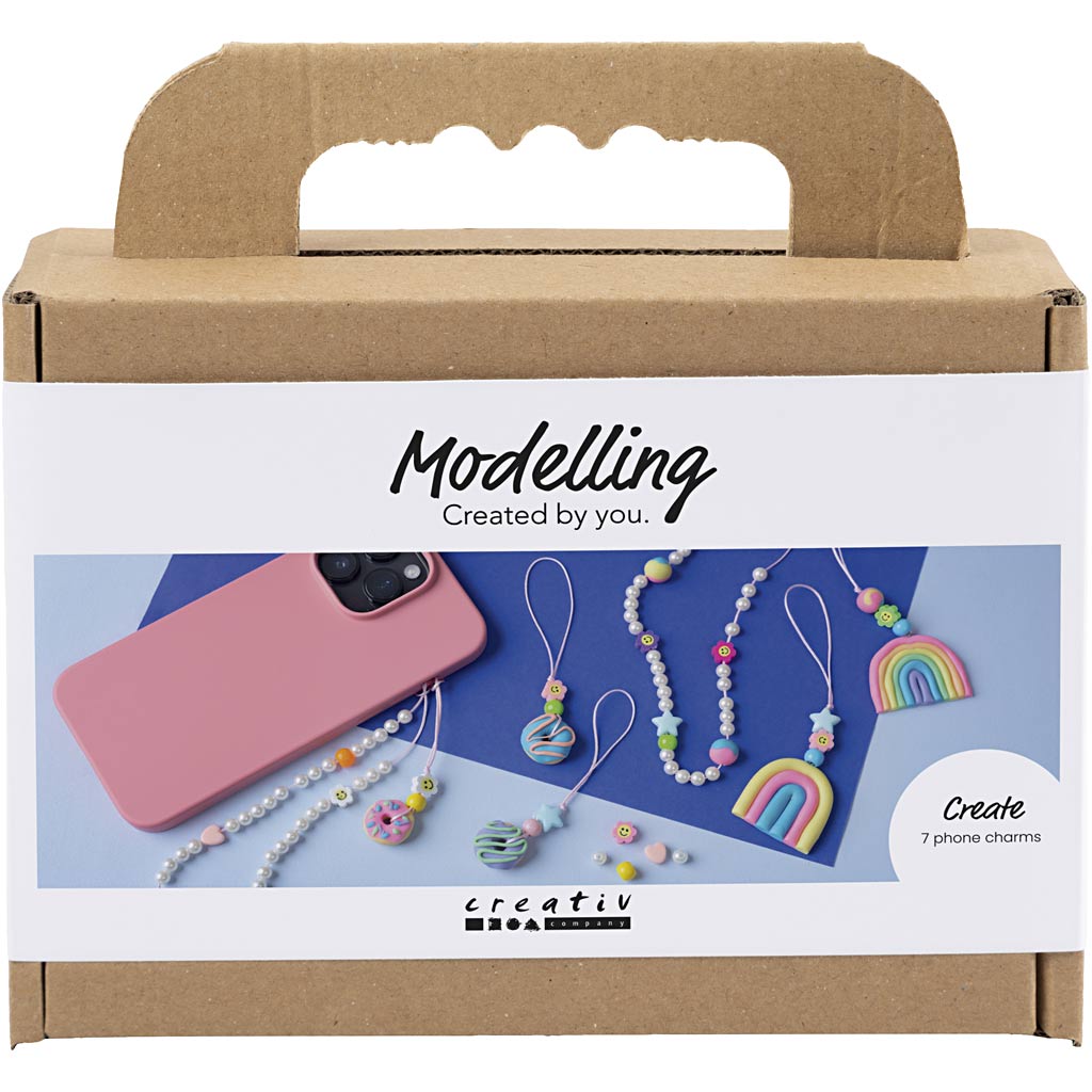 Cardboard box with 'Modelling Created by you' text and images of phone charms on a white background
