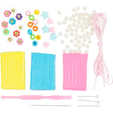 Assorted craft supplies including beads, string, and tools on a white background
