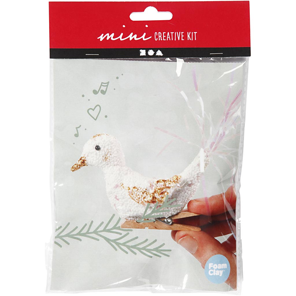 Mini creative kit packaging with a white dove and gold accents, featuring 'mini creative kit' text on a red background.