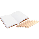 Open notebook with colored pencils on a white background