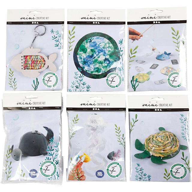 Packaging of mini creative kits with various craft items on a white background