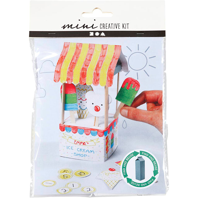 Mini creative kit packaging with ice cream shop design and hand holding a card.