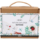 Nature explorer suitcase DIY kit packaging with illustrations of nature-themed items.
