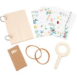 Set of stationery items including a notebook, stickers, rubber bands, and a magnifying glass on a white background.