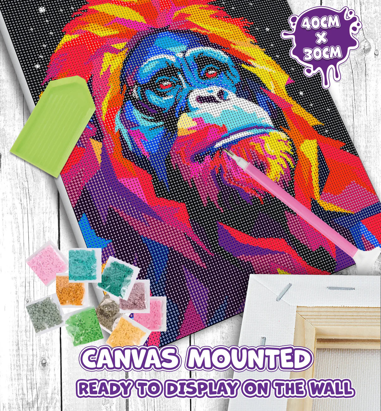 Colorful monkey diamond painting kit with tools and beads on a wooden surface