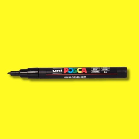 Uni Posca PC-3M marker on a yellow background