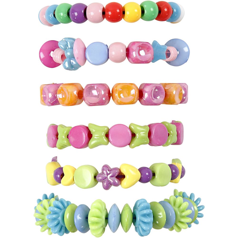 Set of colorful beaded jewellery made with elastic cord with various textures on a white background