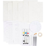 Art supply set with paint tubes, brushes, and a mask on a white background