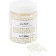 Jar of wax beads with a white lid on a white background