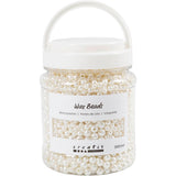 Jar of white wax beads with a visible brand label on a white background