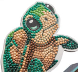 Tortoiseshell-patterned item with bead embellishments on a white background