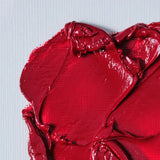 Red paint mixed with refined linseed oil on a white canvas 