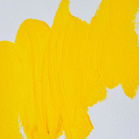 Yellow oil paint mixed with safflower oil on a white canvas