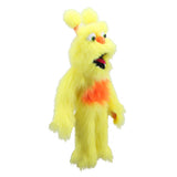 A yellow furry monster puppet or plush character with orange chest details, a pointed orange nose, and a wide open mouth showing black and red interior, isolated on a white background.