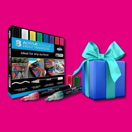 Acrylic paint marker set beside a blue gift box 