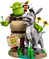 Toy figure of Shrek and Donkey with a donkey robot, on a green background