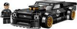 Toy model of a black and yellow car with 'Hoonigan' branding, accompanied by a driver figure.