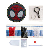 Spider-Man themed craft kit with beads, tools, and a completed design on a white background