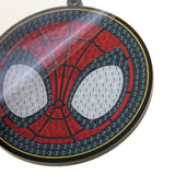 Circular object with spider web design and numbers on a white background