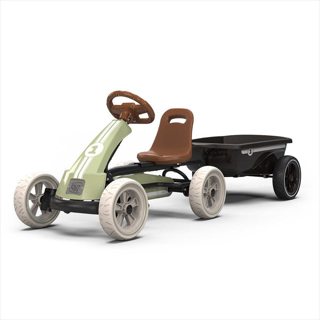 Children's pedal car with a green body, brown seat, and black trailer on a white background