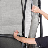Person adjusting a mesh screen on a door with a white background