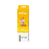 Yellow packaging of Hey Clay Shiba Inu clay set on a white background