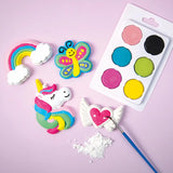 Colorful candy decorations including a rainbow, butterfly, unicorn, and heart with wings on a pink background.