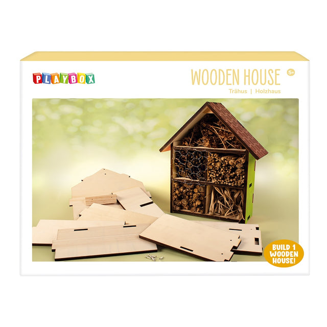 Playbox wooden house kit packaging with wooden pieces and completed house on a light green background.