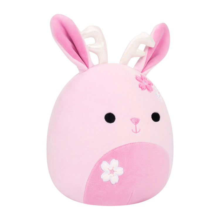 A pink plush bunny toy with white inner ears, embroidered black eyes, a small pink nose, a pink flower on the head, and a white flower on the belly, shown on a plain white background.