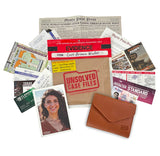 A flat-lay arrangement of mystery file and evidence-themed accessories on a white background, including a brown envelope-style wallet, a kraft paper file labeled 'Unsolved Case Files,' a red evidence marker, newspaper clippings, cards, and a photo print.
