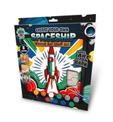 A packaged wooden art craft kit labeled 'Create Your Own Spaceship' with a colorful space-themed box showing a rocket, paint pots, and small included components.